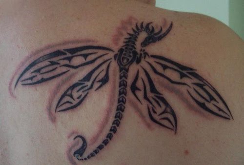 Nice Black Ink Tribal Dragonfly Tattoo on Back Shoulder