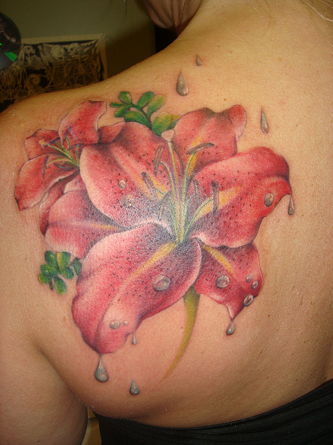 Nice Lily Flower Tattoo On Left Back Shoulder