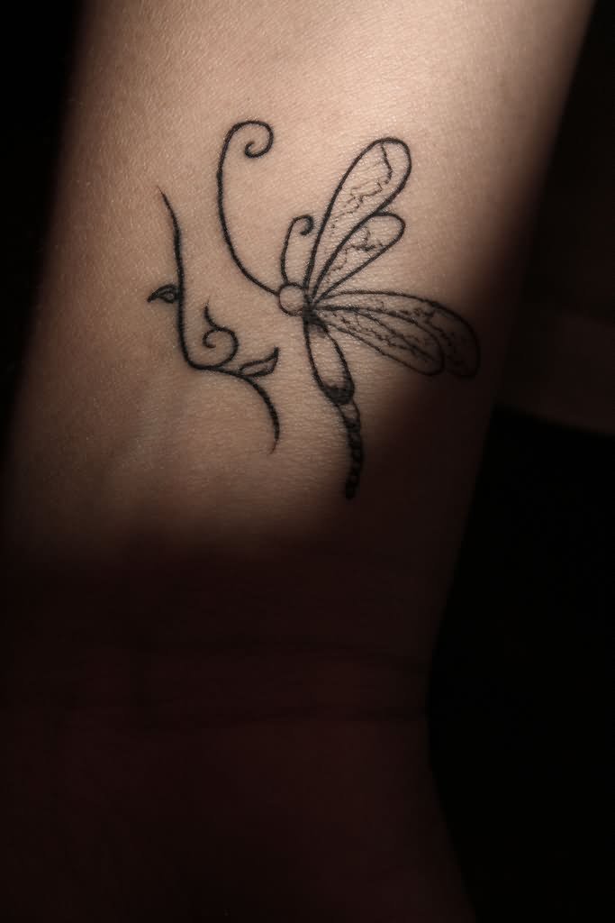 Nice Outline Flying Dragonfly Tattoo On Wrist
