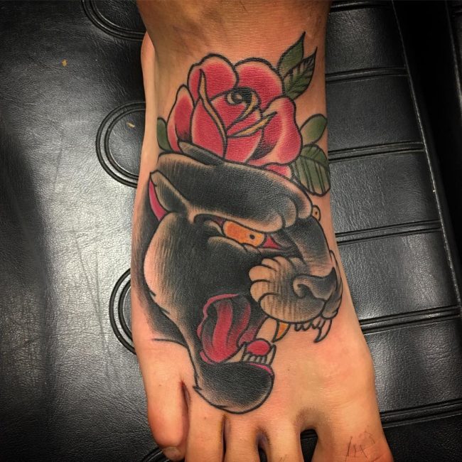 Nice Rose Fower And Panther Head Tattoo On Foot