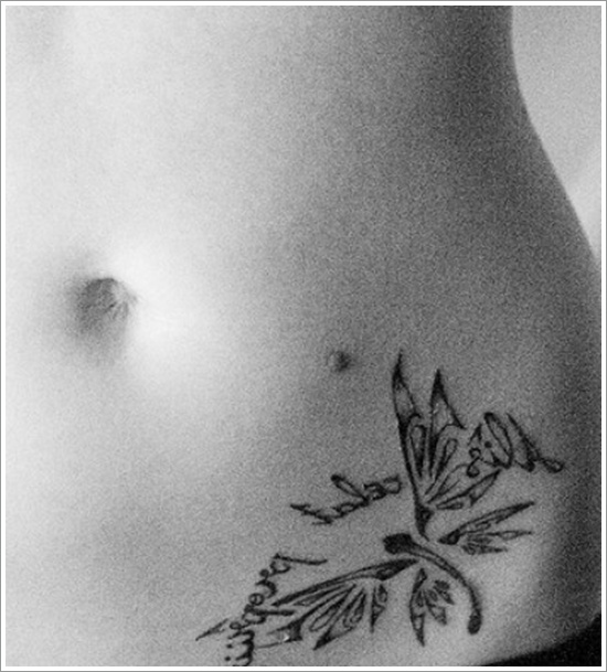 Nice Tribal Dragonfly Tattoo On Left Hip