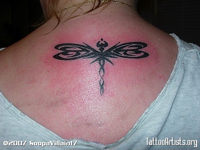 Nice Tribal Dragonfly Tattoo On Upper Back