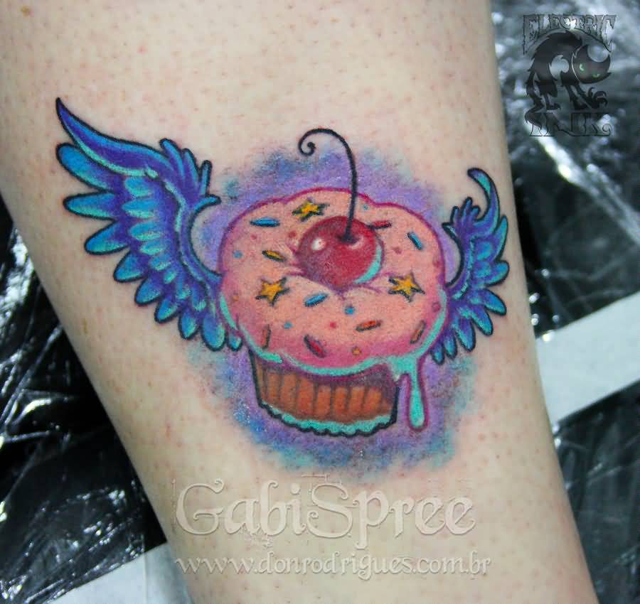 Nice winged Cupcake Tattoo On Side Leg