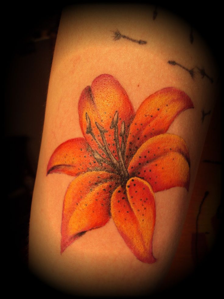 Orange Ink Realistic Lily Tattoo On Leg