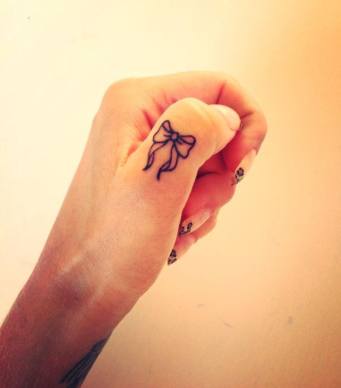 Outline Bow Tattoo On Girl Thumb