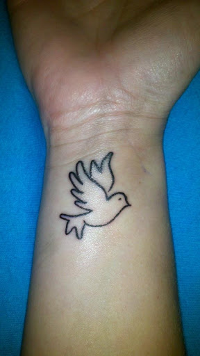Outline Flying Dove Tattoo On Wrist