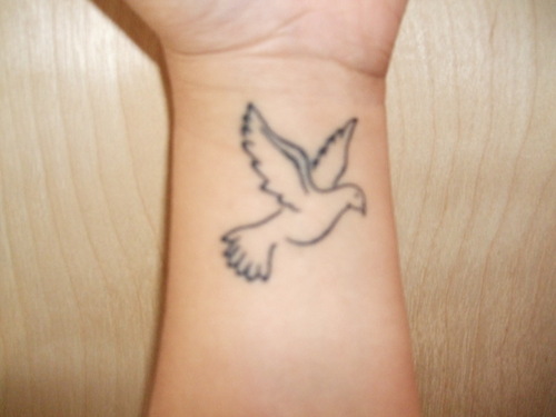 Outline Flying Dove Tattoo On Wrist