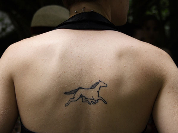 Outline Running Horse Tattoo On Upper Back