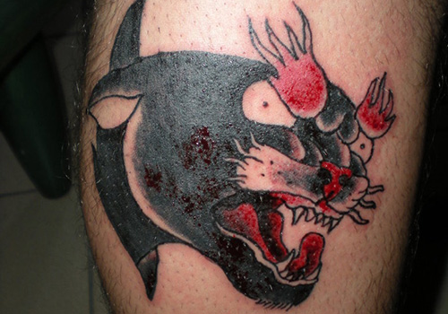 Panther Mouth With Blood Tattoo On Side Leg