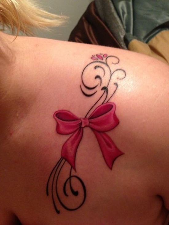 Pink Bow Tattoo On Girl Front Shoulder
