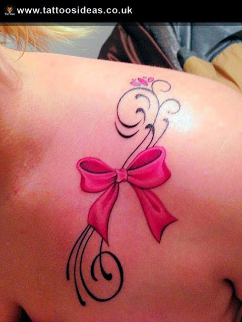 Pink Bow Tattoo On Girl Front Shoulder