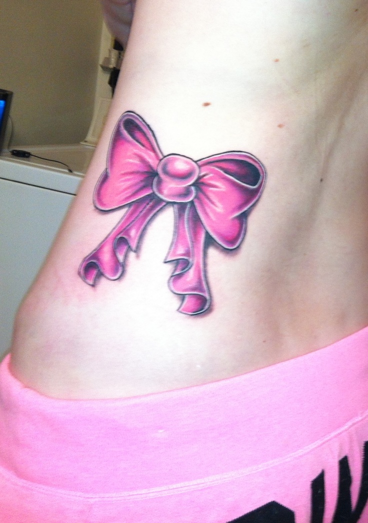 Pink Bow Tattoo On Girl Side Rib
