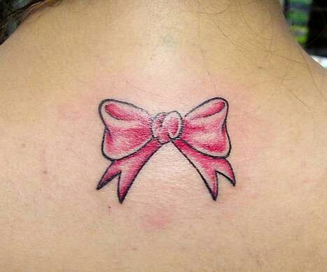 Pink Bow Tattoo On Girl Upper Back