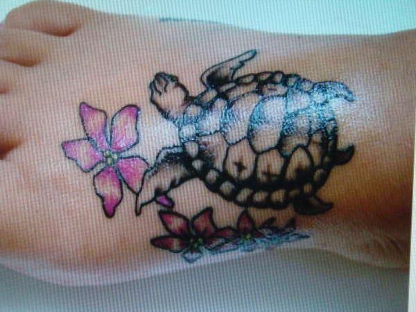 Pink Flowers And Turtle Tattoo On Right Foot