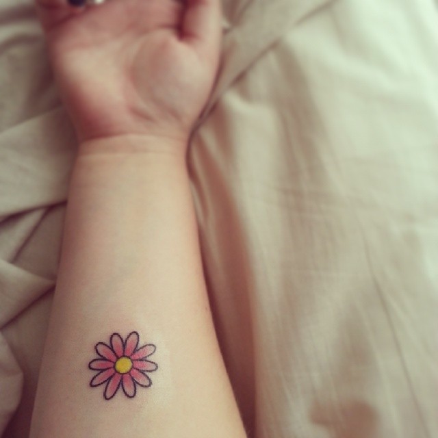 Pink Small Daisy Tattoo On Girl Right Wrist