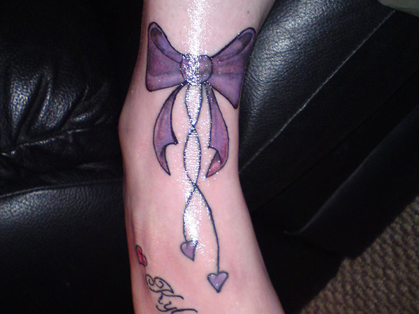 Purple Ink Bow Tattoo On Ankle