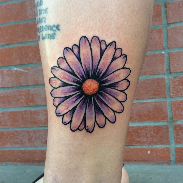 Purple Ink Daisy Flower Tattoo On Side Leg