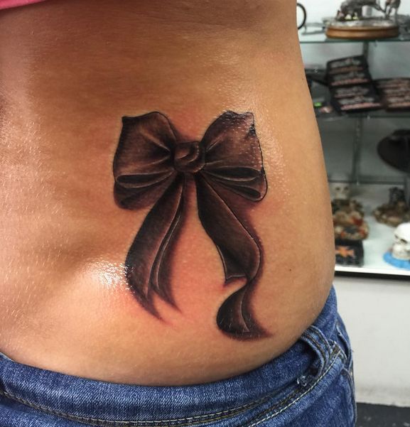 Realistic Bow Tattoo On Girl Lower Back