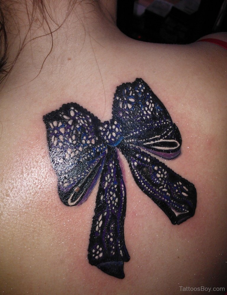 Realistic Bow Tattoo On Upper Back