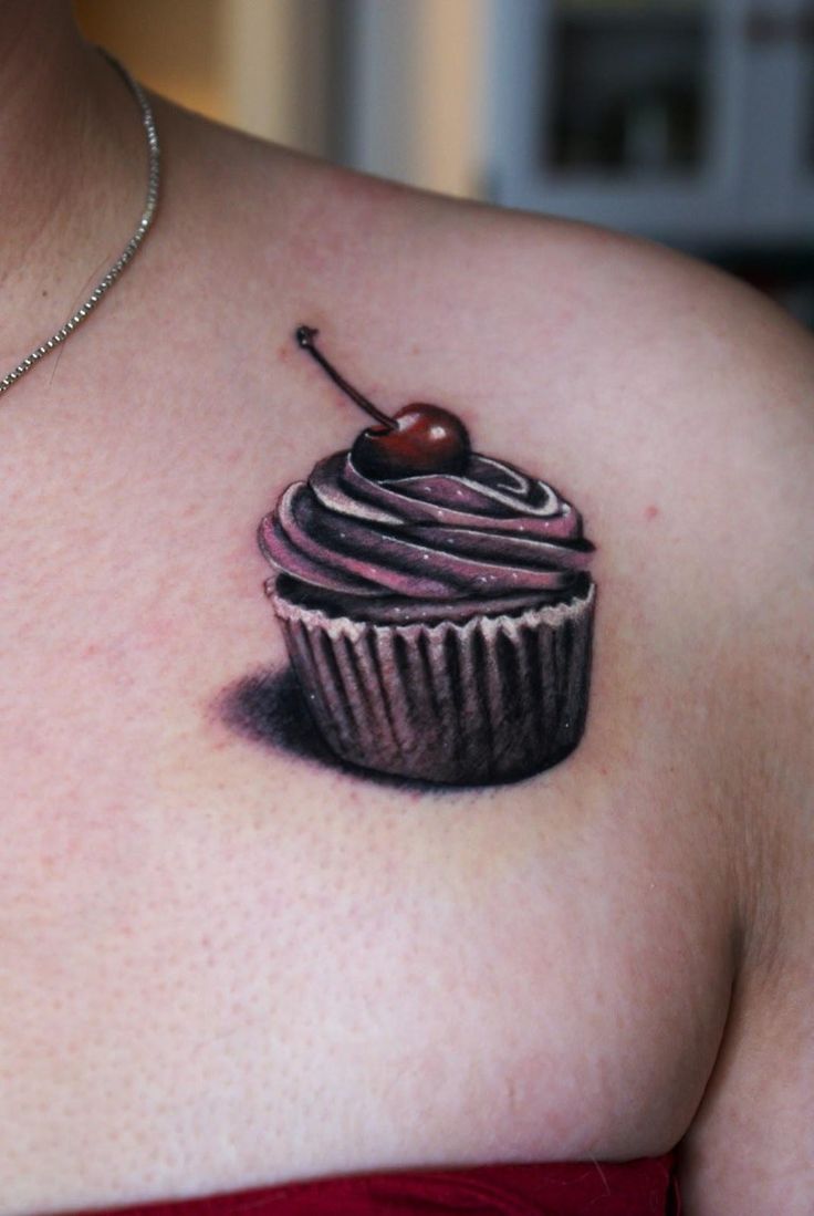 Realistic Cupcake Tattoo On Front Shoulder