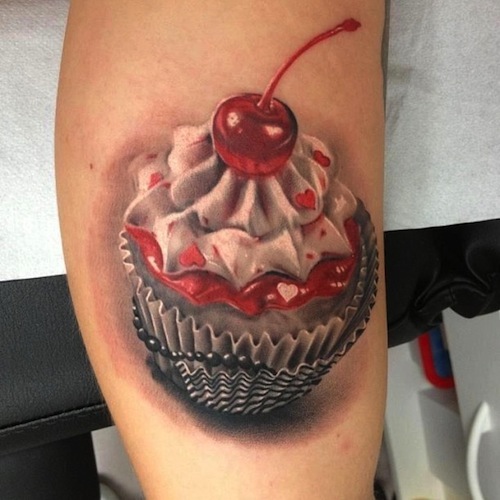 Realistic Cupcake Tattoo On Right Arm