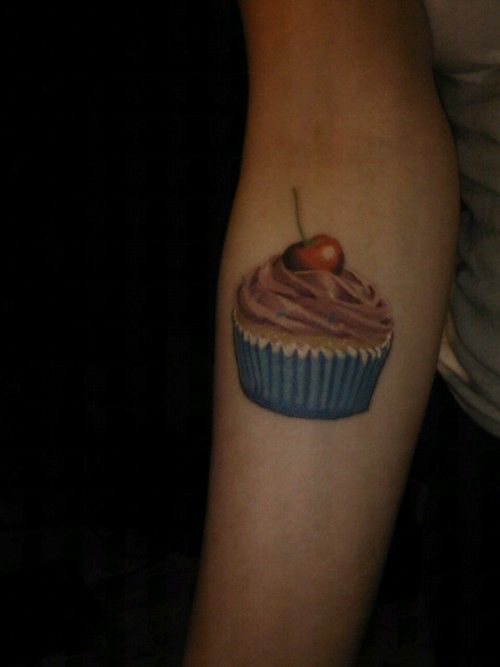 Realistic Cupcake Tattoo On Right Forearm