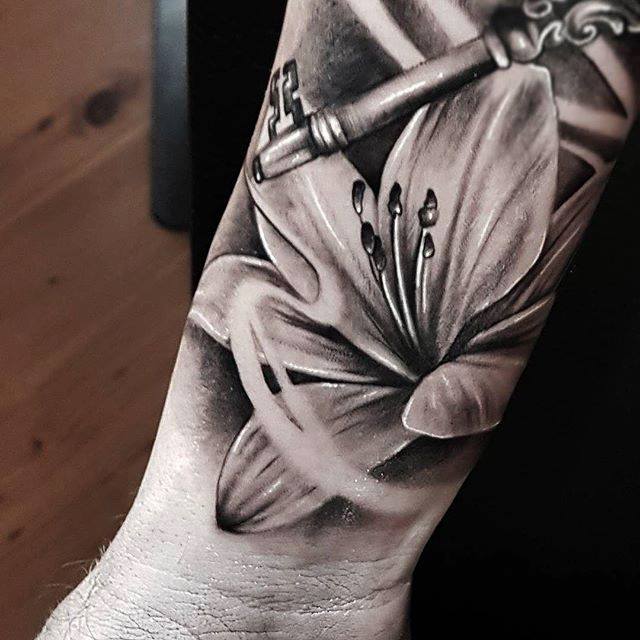 Realistic Grey And Black Lily Flower Tattoo On Forearm