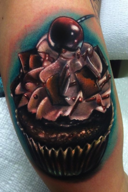 Realistic cupcake With Cherry Tattoo On Bicep