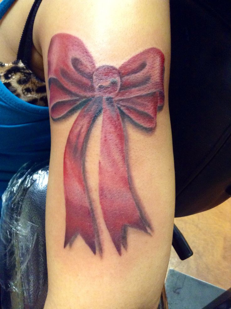 Red Bow Tattoo On Girl Left Bicep