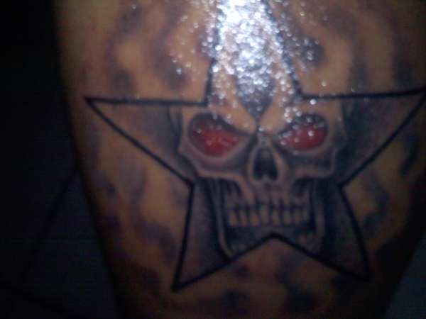 Red Eyes Skull In Star Tattoo