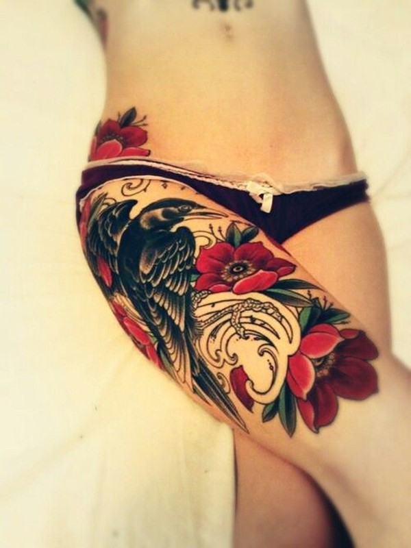 Red Flowers And Wolf With Raven Tattoo On Thigh