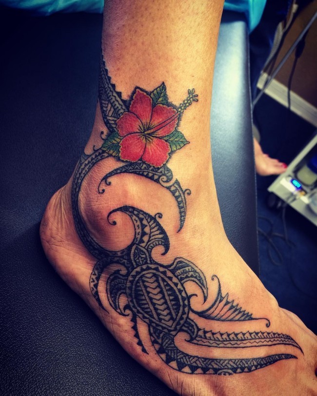 Red Hawaiian Flower And Polynesian Turtle Tattoo On Foot