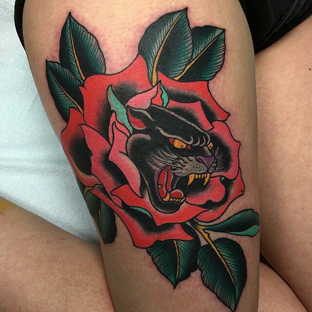 Red Rose And Black Panther Tattoo On Thigh