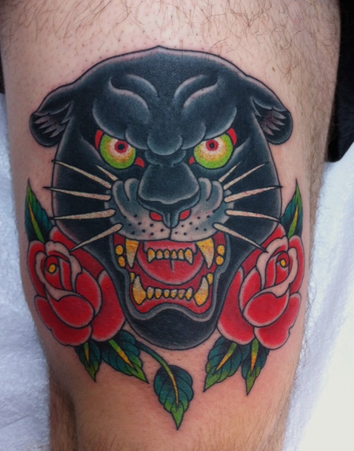 Red Roses And Panther Head Tattoo On Thigh