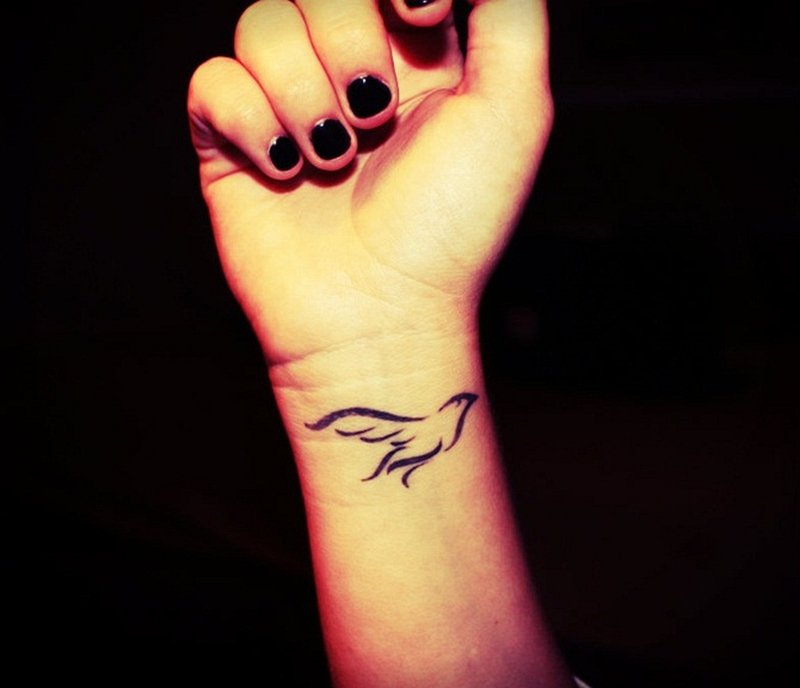 Right Wrist Black Tribal Dove Tattoo