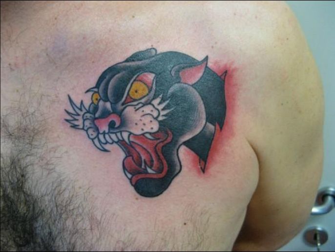 Ripped Skin Angry Panther Head Tattoo On Man Front Shoulder