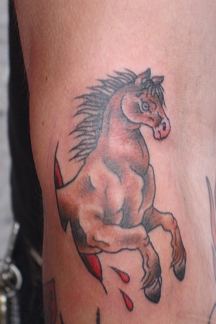 Ripped Skin Running Horse Tattoo