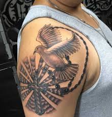 Rosary Cross And Flying Dove Tattoo On Shoulder