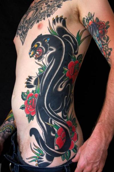 Rose Flowers And Black Panther Tattoo On Man Left Rib Side