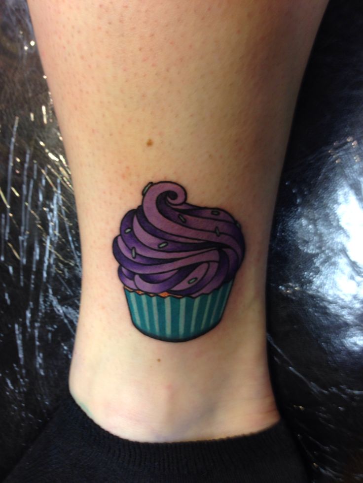 Simple Cupcake Tattoo On Girl Leg