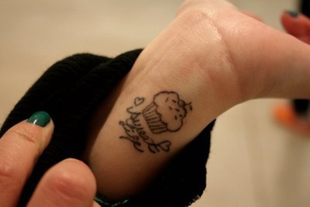 Simple Cupcake Tattoo On Girl Wrist