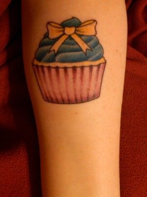 Simple Cupcake Tattoo On Left Forearm