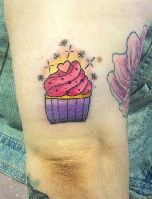 Simple Cupcake Tattoo On Right Bicep For Women