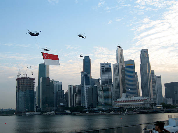 Singapore National Day Parade Helicopters With Flag Over The Skylines Of Singapore