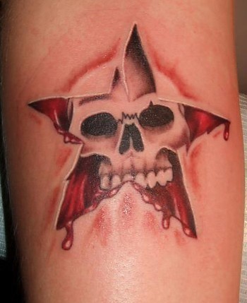 Sipped Skin Skull In Star Tattoo On Bicep