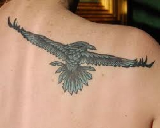 Small Blue Raven Tattoo On Man Right Back Shoulder