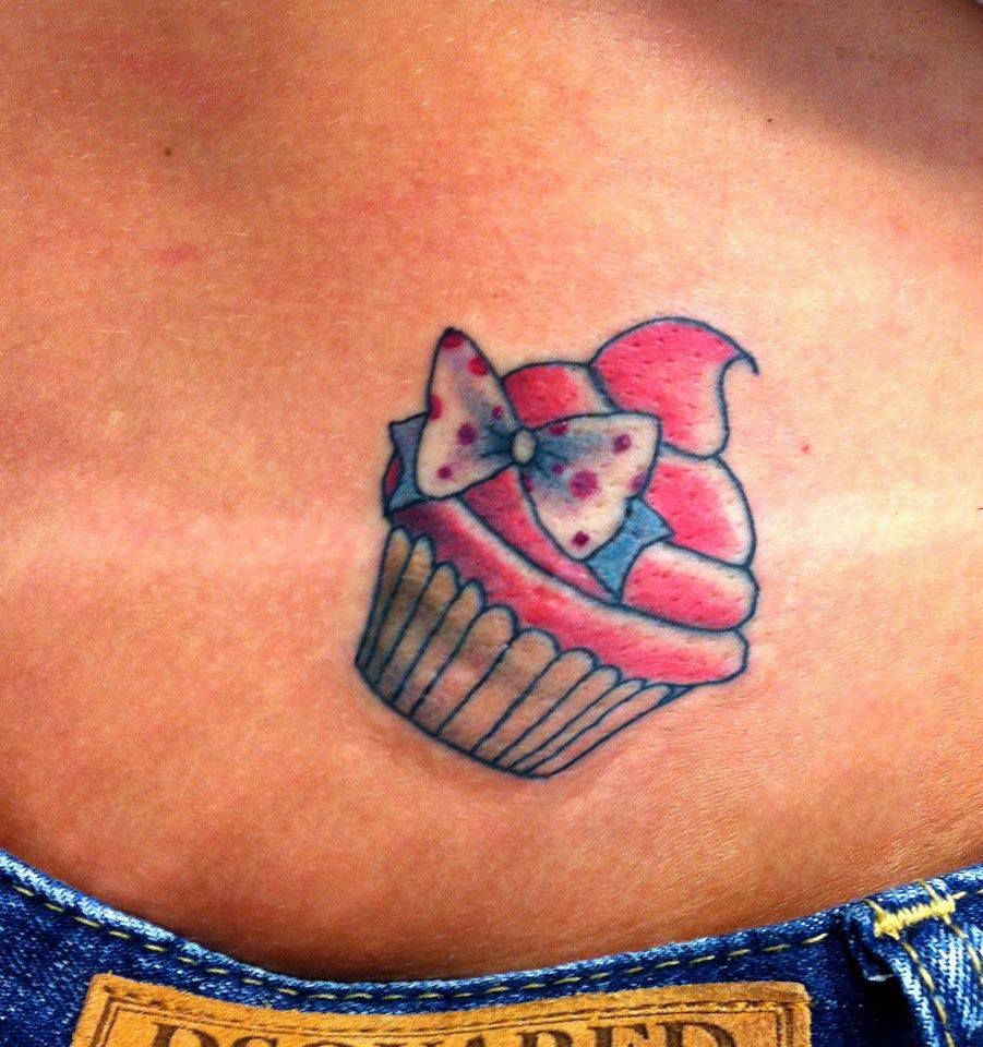 Small Bow With Cupcake Tattoo On Lower Back