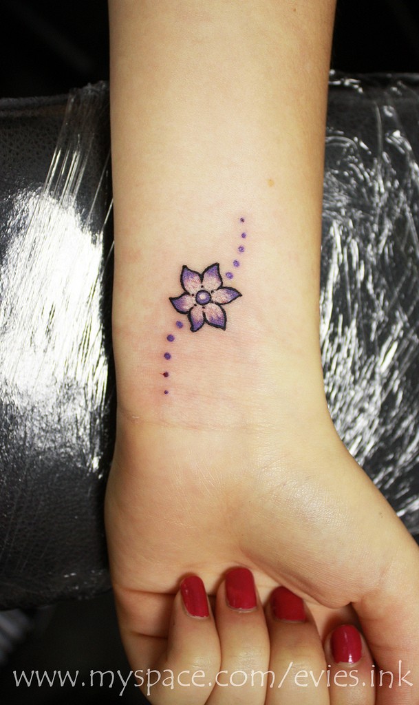 Small Lily Tattoo On Left Wrist