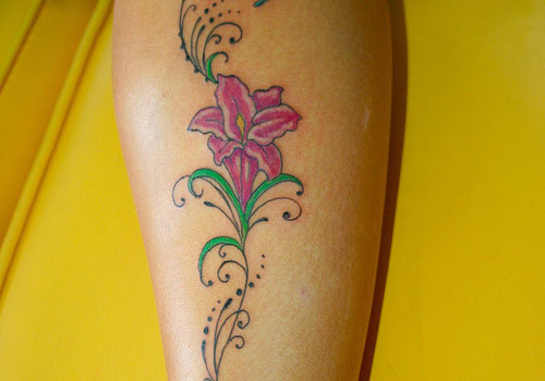 Small Lily Tattoo On Side Leg