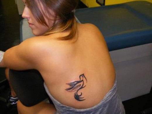 Small Peace Dove Tattoo On Girl Back Body